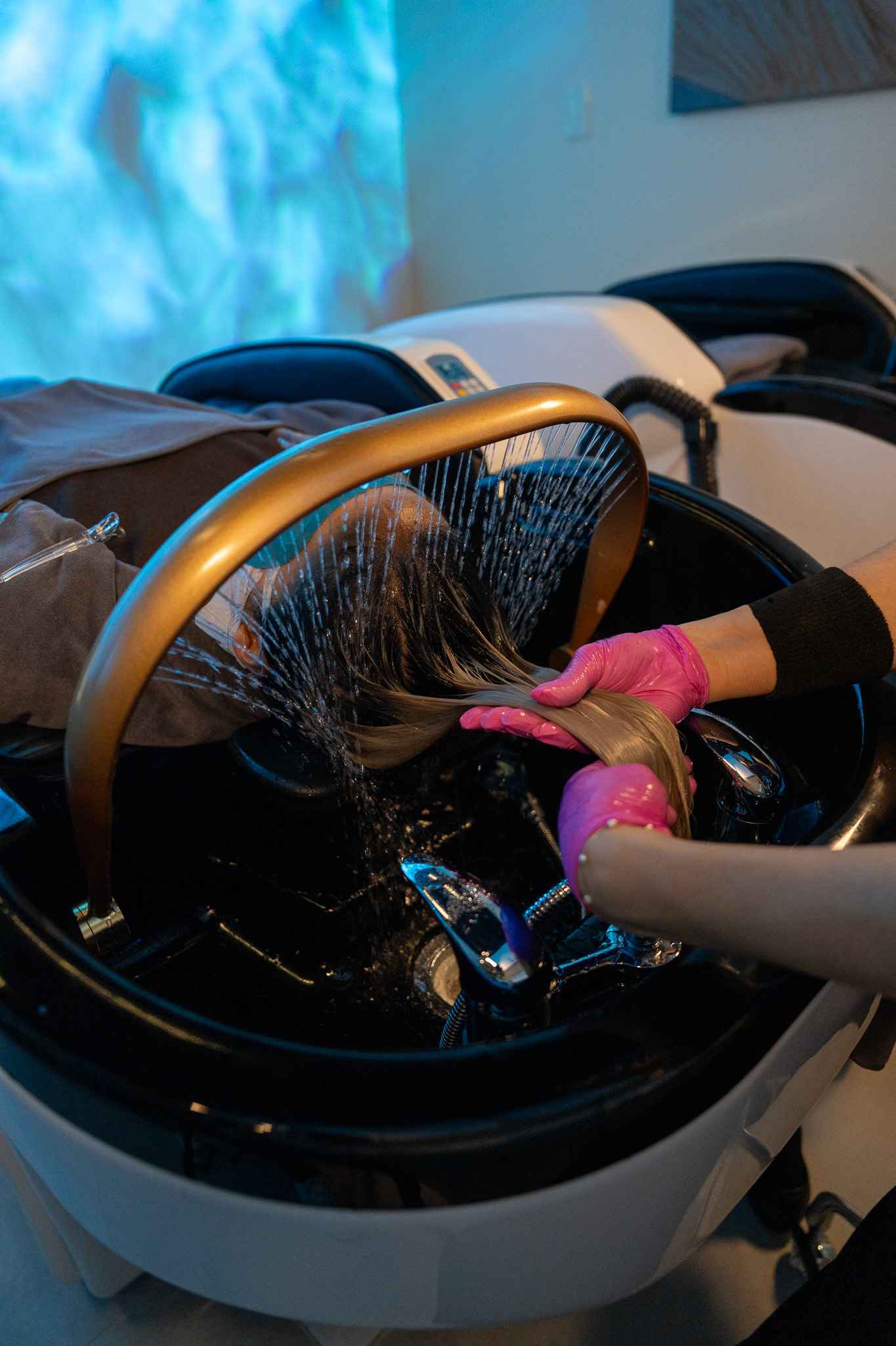 Invita Costa Mesa therapist performing a restorative scalp treatment
