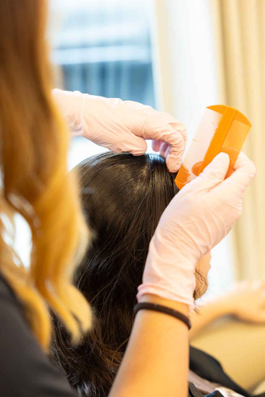 Invita therapist performing a scalp analysis in Fort Lauderdale