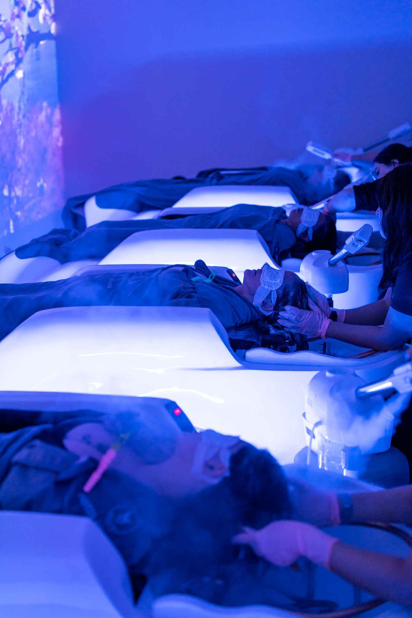 Blue-lit treatment beds at Invita Head Spa Las Vegas