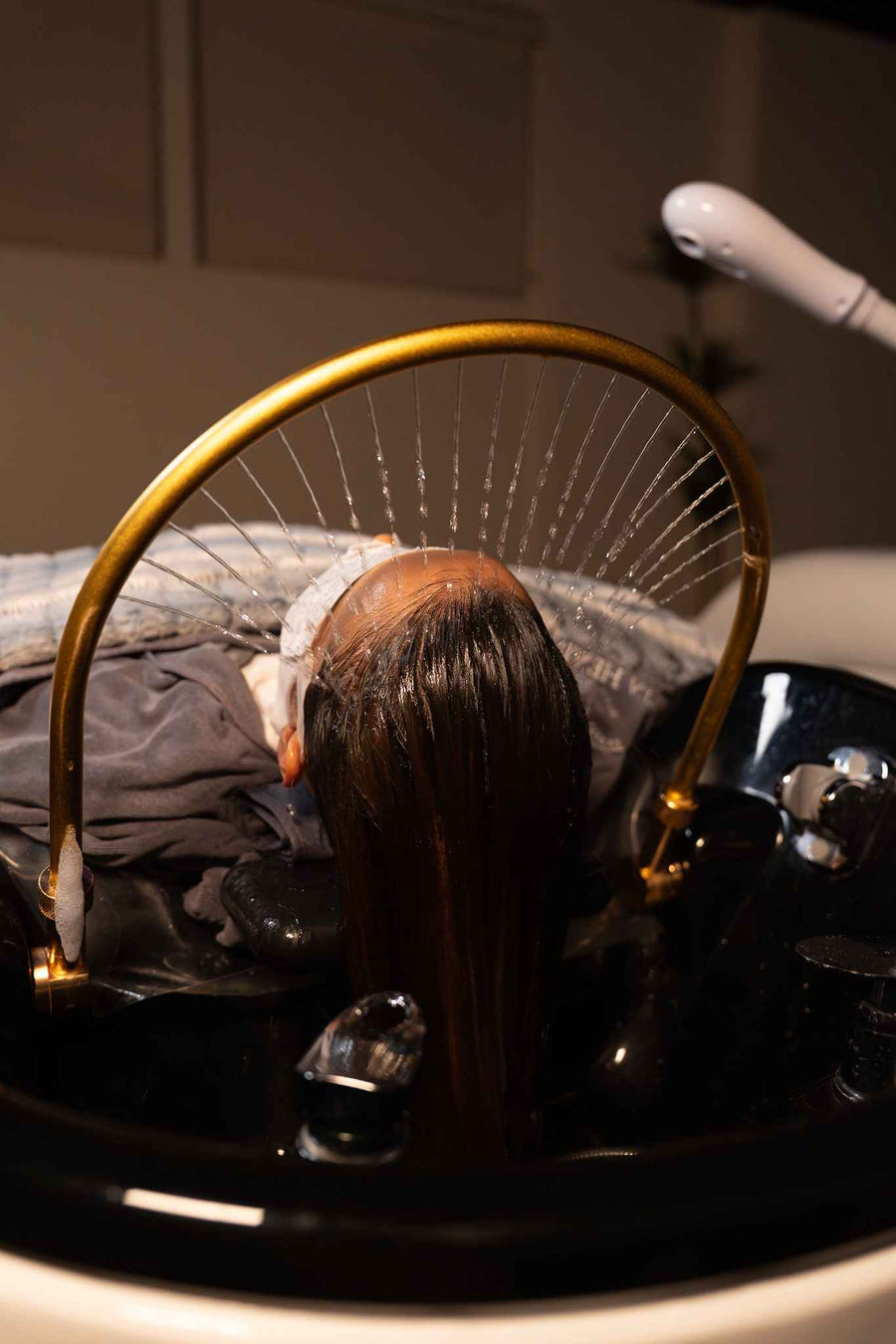 Waterfall-style rinse at Invita Head Spa Vista