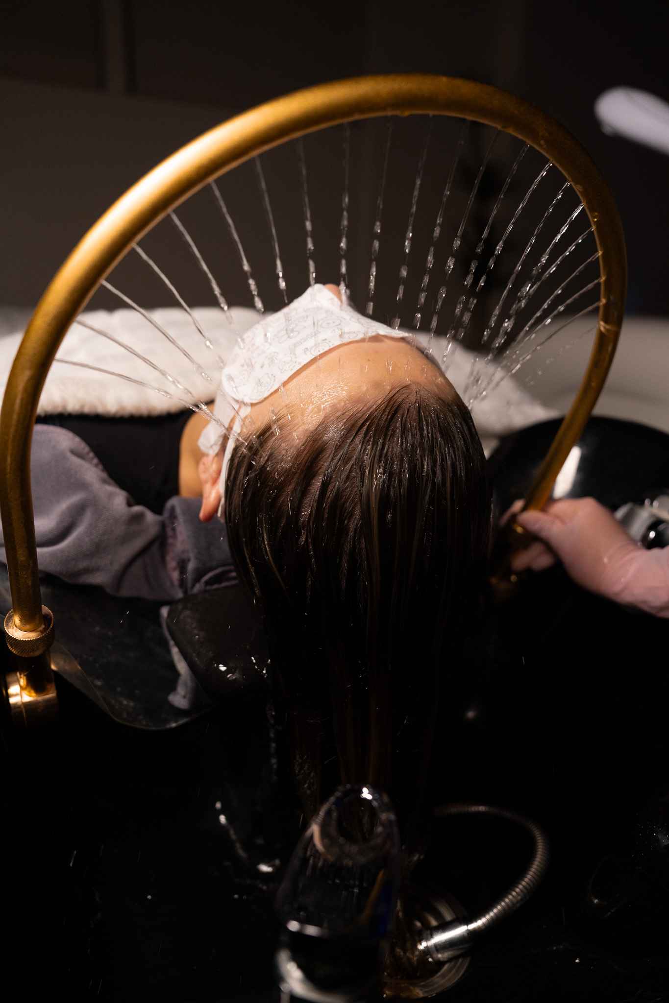 Guest receiving the signature head spa ritual at Invita Head Spa Vista